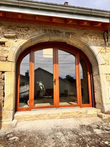 Porte d'entrée cintrée en bois